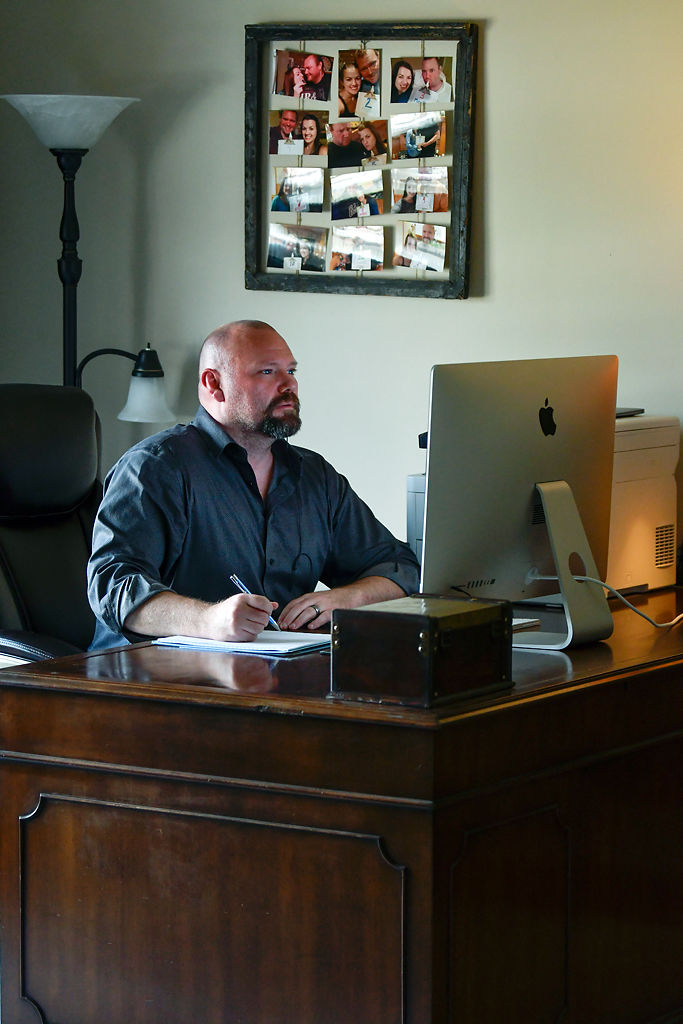 Jared Torbet sits in his home office